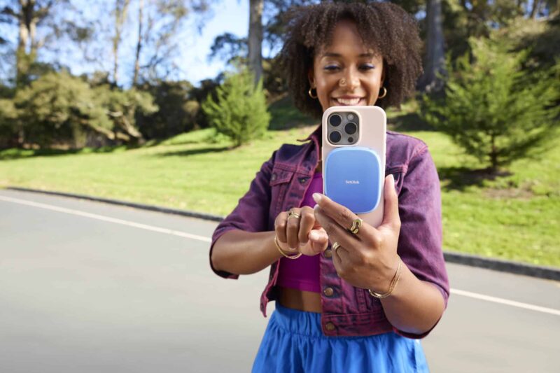 Life: SanDisk Creator Phone SSD Portable SSD with MagSafe, Lifes SanDisk Creator Phone SSD - Lifestyle, attached to iPhone